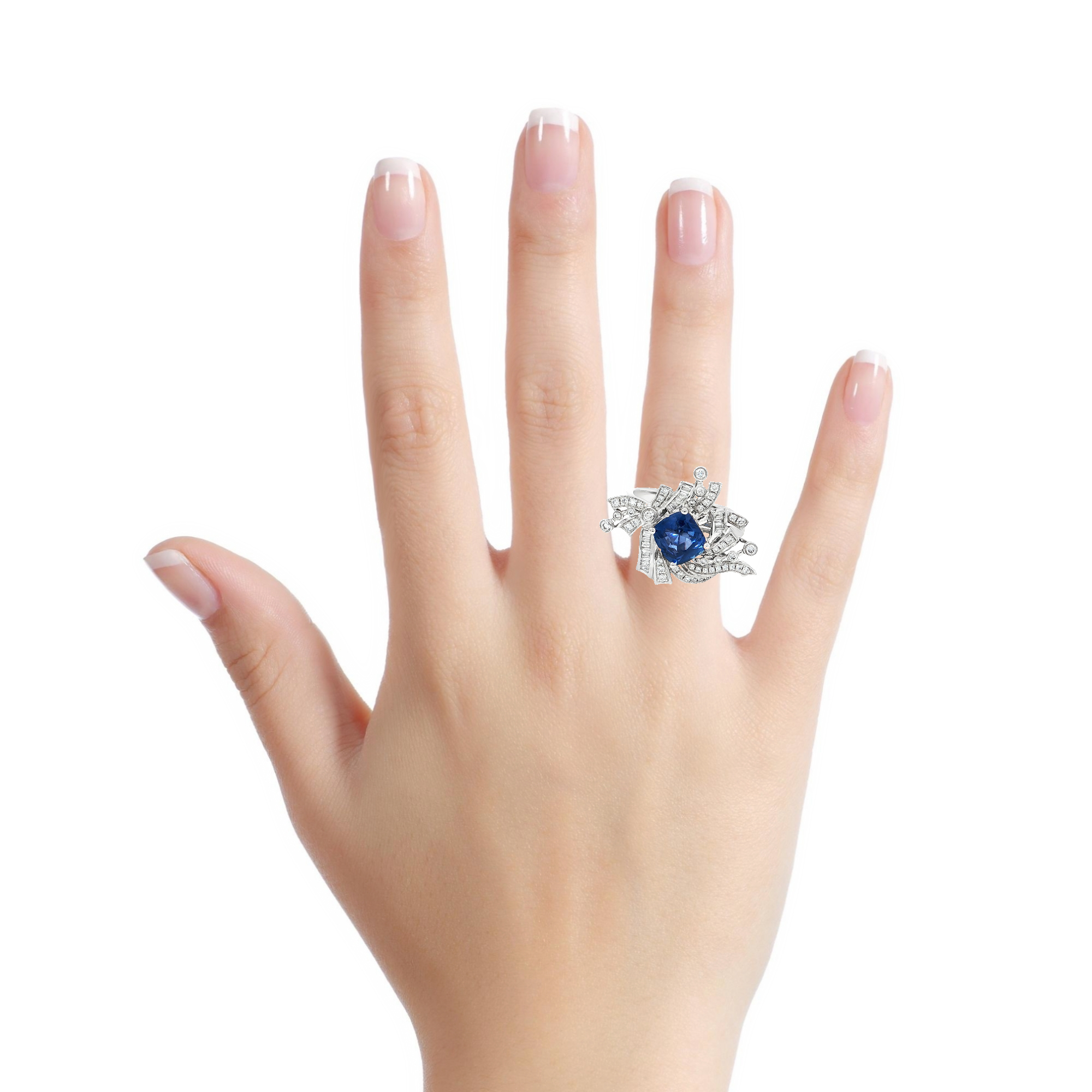Bague cocktail en or blanc avec saphir bleu profond taille coussin