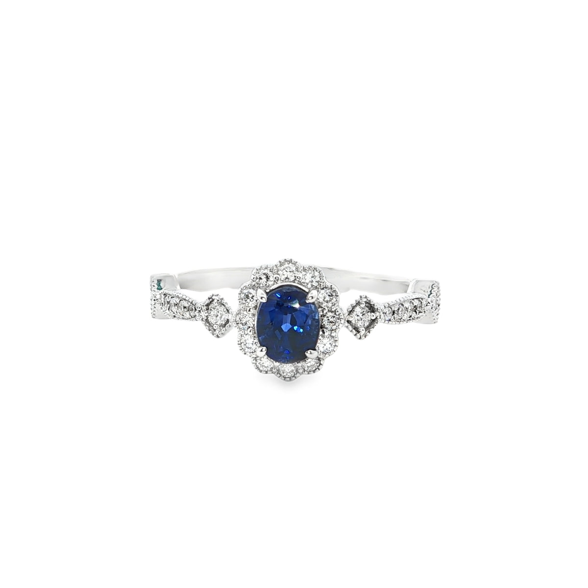 Bague en or 18K avec saphir et diamants latéraux