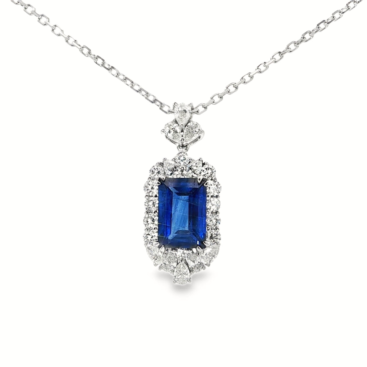White Gold Charm Necklace with Deep Blue Emerald Cut Sapphire