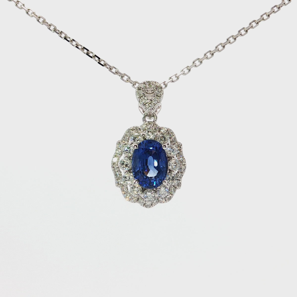 Load video: Vivid Blue Sapphire and White Gold Charm Necklace