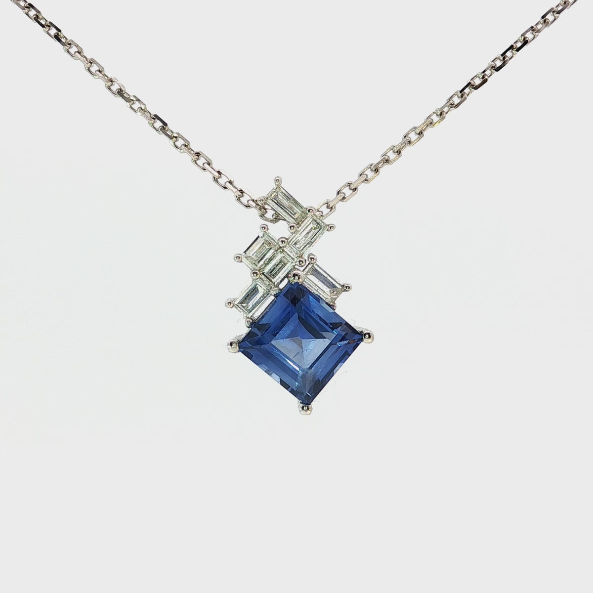 Load video: White Gold Necklace with Deep Blue Square Cut Sapphire Charm