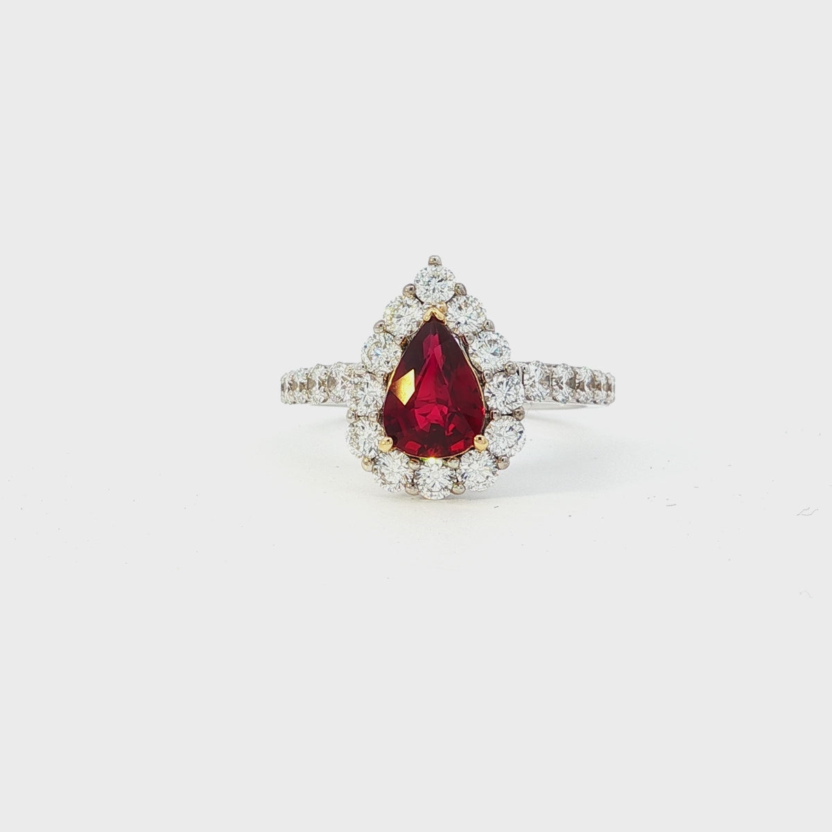 Load video: White Gold Ring with Pear-Shaped Ruby